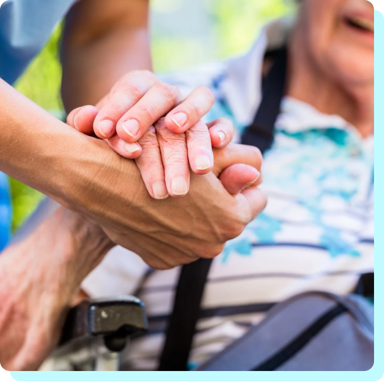 a young hand holding an old hand