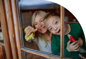 a woman and a disabled girl looking out the window