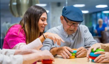 15. nurse-advising-a-elder-man-playing-skill-games-2024-12-09-03-26-19-utc